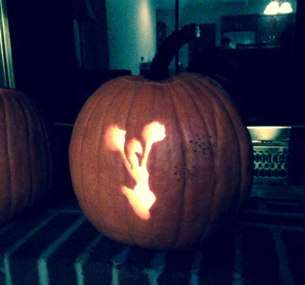 halloween pumpkin of cheerleader with pom poms